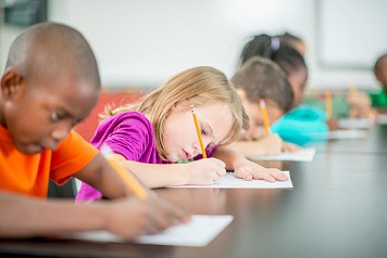 Kids writing a test and taking a quiz